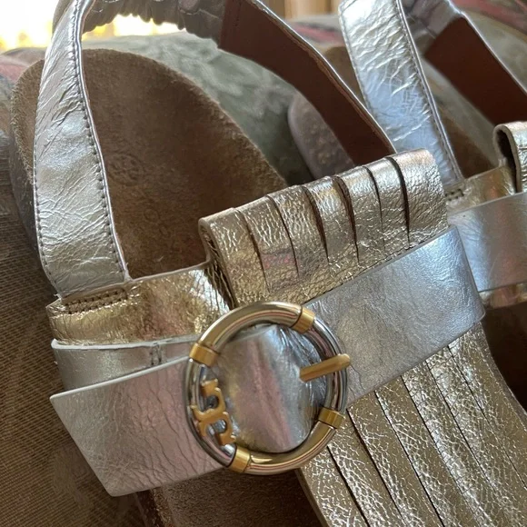 Tory Burch Multi-Logo Kiltie Sandal - Silver / Spark Gold / Natural. Size 7